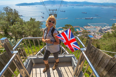 Portrait of woman holding british flag