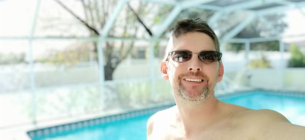 Portrait of young man in swimming pool