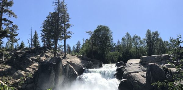 Scenic view of waterfall against sky