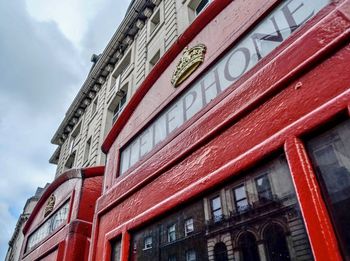 Low angle view of red building against sky