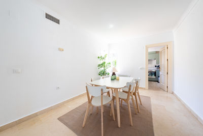 Empty chairs and table at home