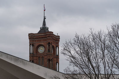 Low angle view of church against cloudy sky