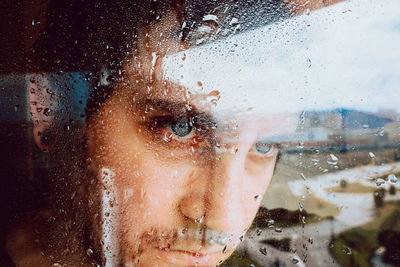 Close-up portrait of wet window in rainy season