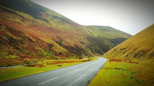 Country road leading towards mountains