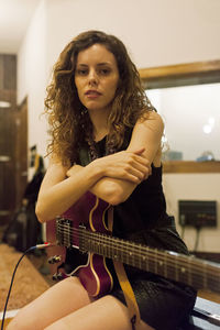 Portrait of a young female guitarist