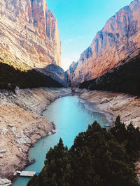 Scenic view of lake and mountains against sky