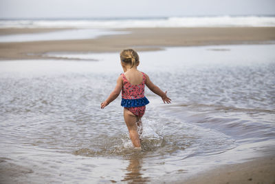 Full length of girl on beach