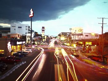 High angle view of light trails on road in city