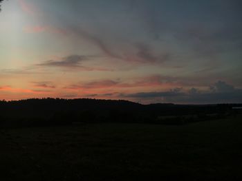 Scenic view of silhouette landscape against sky during sunset