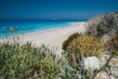 Scenic view of sea against clear blue sky