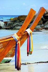 Cropped longtail boats at beach