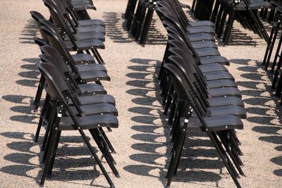 High angle view of empty chairs on street