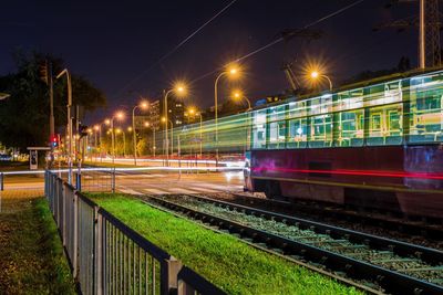 Train on railroad tracks at night