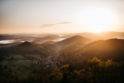 Scenic view of mountains against sky during sunset