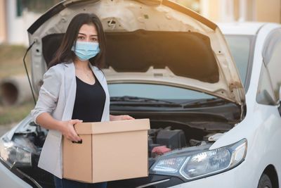 Portrait of a young woman in car