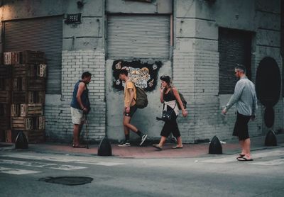 Group of people walking in front of building