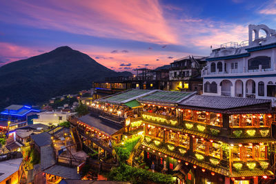 High angle view of illuminated buildings in town at night