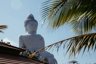 Low angle view of statue against sky