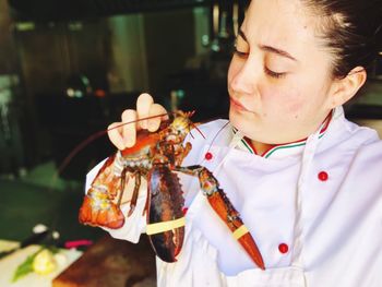 Chef looking at seafood in commercial kitchen