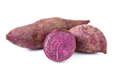 Close-up of fresh fruits against white background