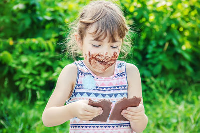 Portrait of cute girl playing in park