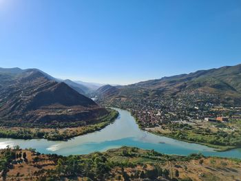 Scenic view of mountains against clear blue sky