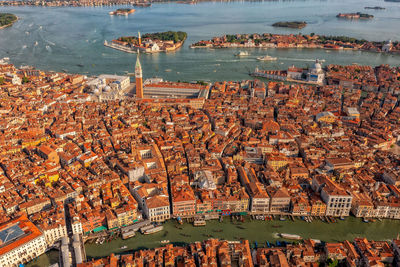 Amazing city view from above on building roofs and canals. aerial view of venice, san polo, italy