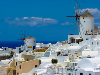 Low angle view of traditional building by sea against sky