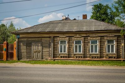 Exterior of building by road against sky