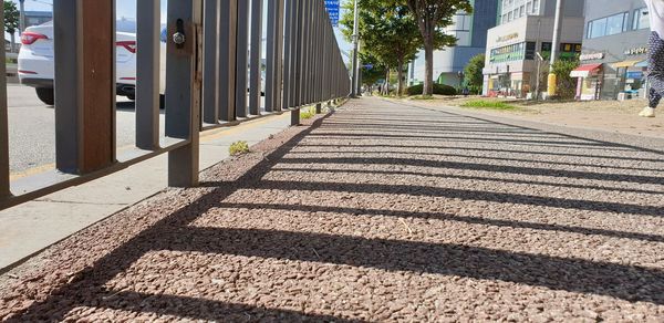 Surface level of shadow on footpath in city