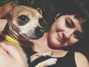 Close-up portrait of woman with dog