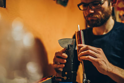 Man preparing machine in workshop