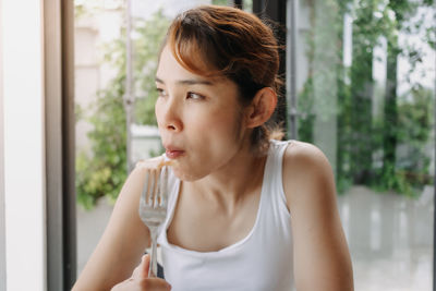 Young woman drinking water