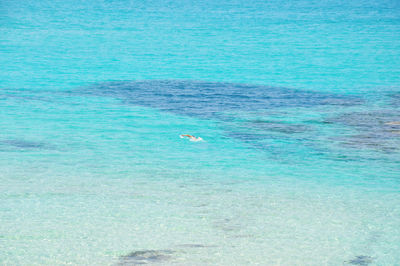 People swimming in sea