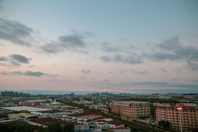 High angle shot of townscape against sky at sunset