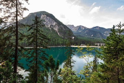 Scenic view of lake and mountains against sky