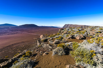 Scenic view of rocky mountains against clear blue sky