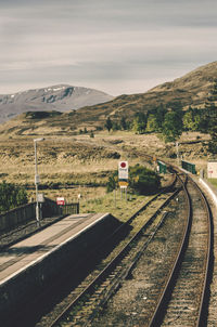 Train on railroad track against sky