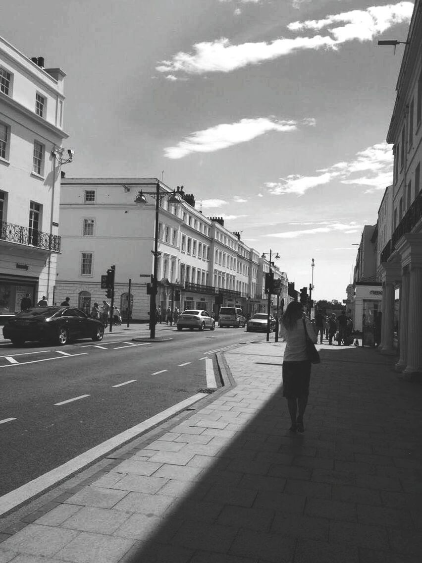 building exterior, architecture, built structure, full length, street, walking, city, rear view, lifestyles, men, city life, transportation, person, leisure activity, sky, road, casual clothing, the way forward