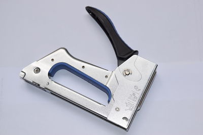 Close-up of stapler on white background