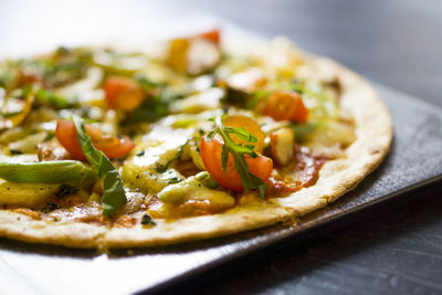 Close-up of pizza served in plate