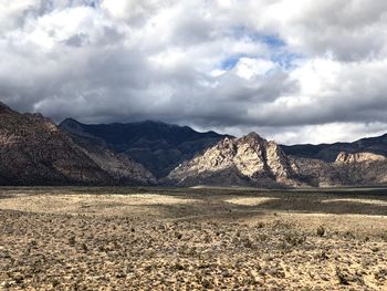 Scenic view of landscape and mountains against sky