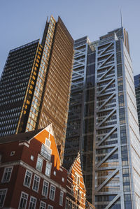 Low angle view of modern buildings against sky