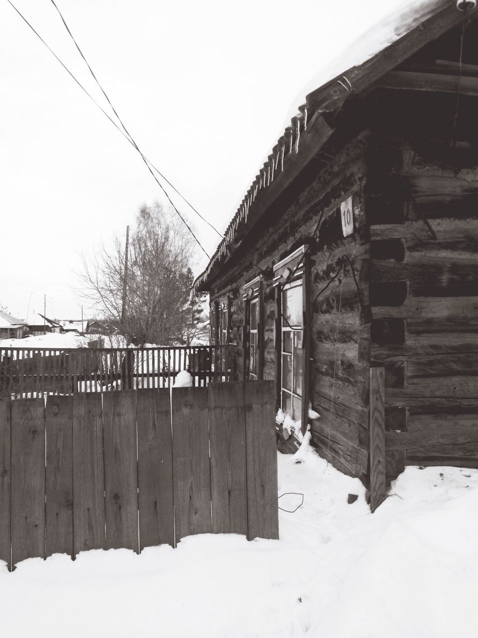 architecture, built structure, building exterior, snow, winter, cold temperature, clear sky, house, railing, sky, connection, day, season, outdoors, bridge - man made structure, weather, residential structure, residential building, roof, nature