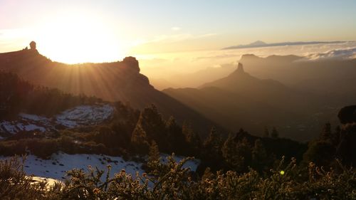 Sunlight streaming on mountains during winter