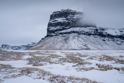 Scenic view of snowcapped mountain against sky