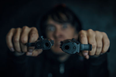 Portrait of man holding camera