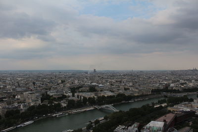 High angle view of buildings and sea against sky