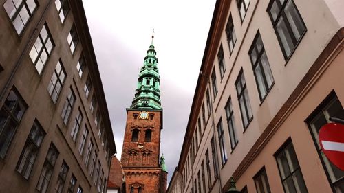 Low angle view of buildings against sky in city