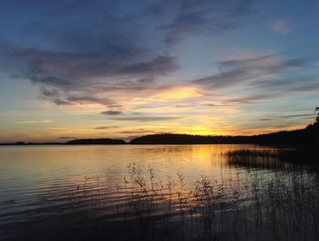 Scenic view of lake against sky during sunset